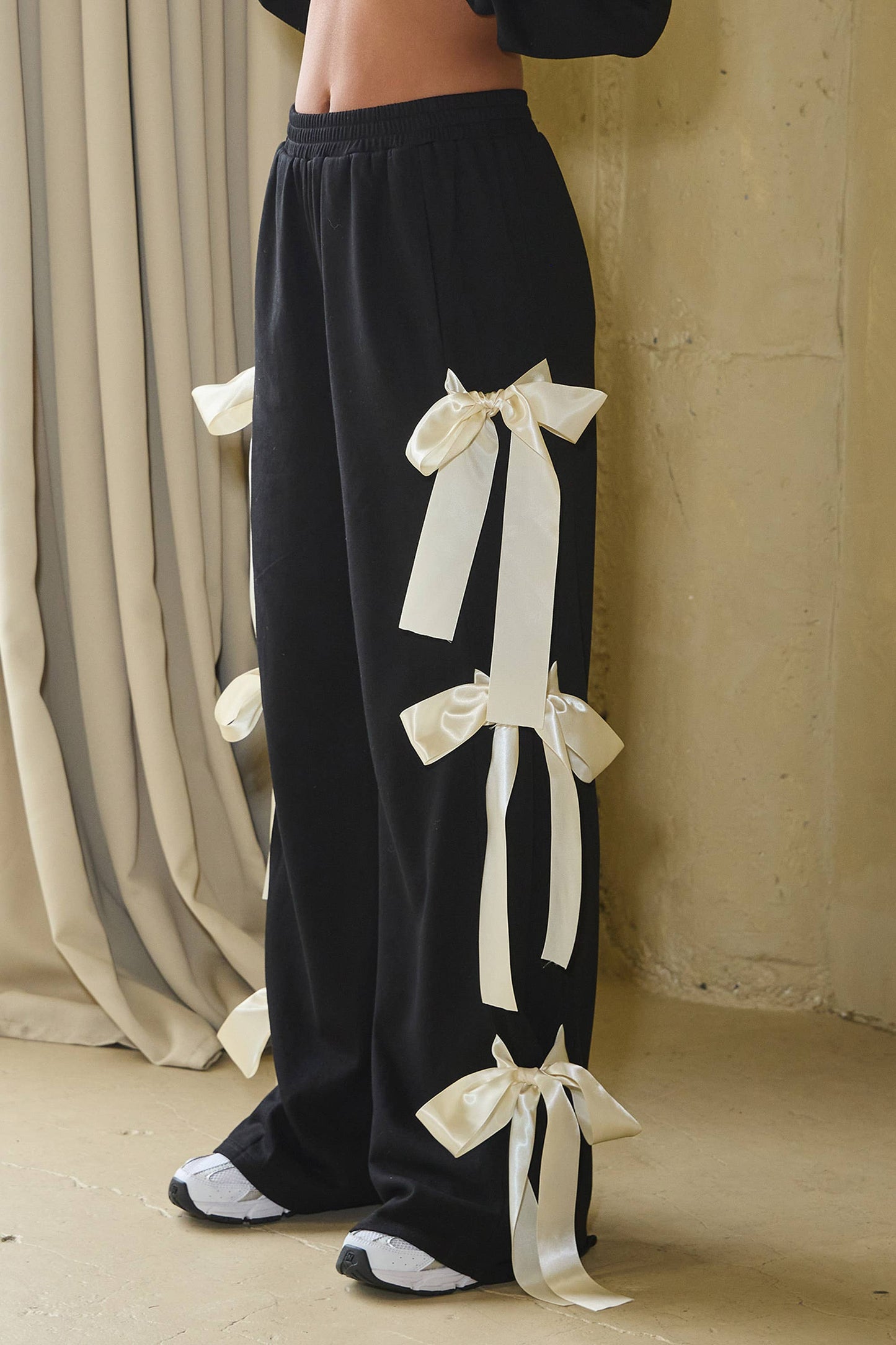 No Vacancy Women's Black French Terry Wide-Leg Pants with Satin Bow Ties